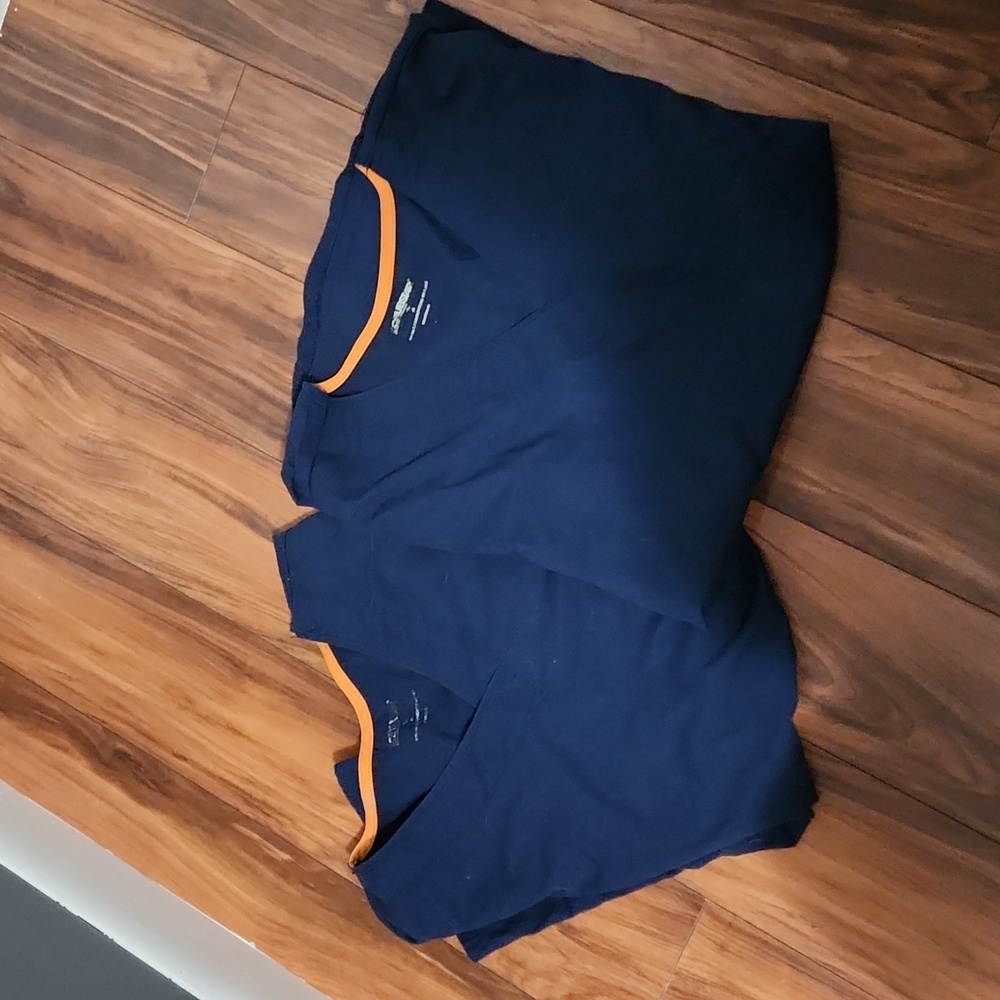 2 medium-sized, royal blue, scrub top, soft fabric, with 3 pockets. 2 for $24